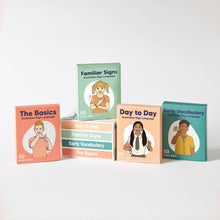 Load image into Gallery viewer, Set of Auslan flashcards and books on Australian Sign Language with colorful covers.