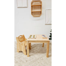 Load image into Gallery viewer, Wooden high chair and table set against a white wall with minimal decor.