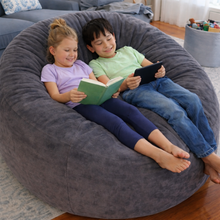 Load image into Gallery viewer, Two children sitting on a large gray bean bag reading books.