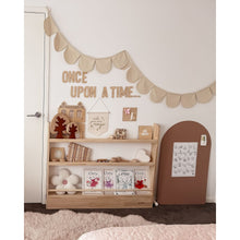 Load image into Gallery viewer, Children's room with a wooden shelf, decorative items, and a 'Once Upon a Time' banner.