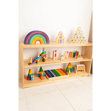 Load image into Gallery viewer, Wooden shelf with colorful children's toys on a white floor and wall