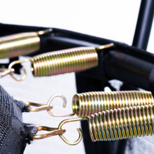 Load image into Gallery viewer, Close-up of black metal spring bars with gold-toned coiled springs and hooks attached to a black mesh bag or harness.