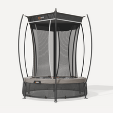 Load image into Gallery viewer, A round trampoline with an attached black safety enclosure net, curved support poles, and a black jumping mat, shown on a clean light gray studio background. The brand name 'FOY' is visible on the top canopy and side frame.