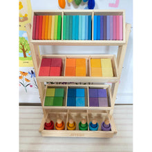 Load image into Gallery viewer, Wooden toy shelf with colorful blocks and wooden figures on a light background