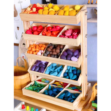 Load image into Gallery viewer, Wooden toy organizer with colorful wooden blocks on a shelf.