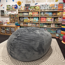 Load image into Gallery viewer, Gray bean bag chair in a room with bookshelves and children's toys
