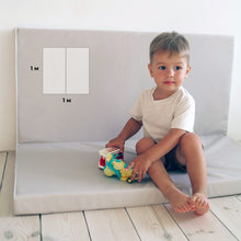 Load image into Gallery viewer, Child playing with a toy on a white mat with measurement markings
