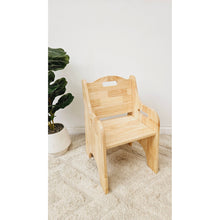 Load image into Gallery viewer, Wooden chair on a light-colored carpet with a plant in the background
