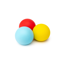 Load image into Gallery viewer, Three matte-colored exercise or massage balls in red, light blue, and yellow, arranged together on a clean white background.
