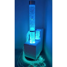 Load image into Gallery viewer, Laser light show with blue and green lights on a dark background
