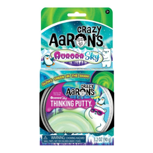 Load image into Gallery viewer, Crazy Aaron's Aurora Sky Thinking Putty in its original retail packaging, featuring a green glow-in-the-dark feature and a polar bear illustration.
