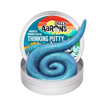 Load image into Gallery viewer, A silver metal tin of Crazy Aaron's Magnetic Happy Earth Thinking Putty, featuring a long, glittery blue spiral of the putty on a white background.
