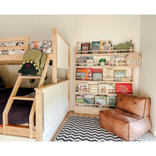 Load image into Gallery viewer, Children's room with wooden bunk bed, bookshelf, and brown chair.
